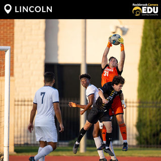 Soccer players on a field in mid play - image by Braded Cochran